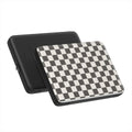 Black and white checkboard pattern laptop sleeve with a plain black sleeve on a white background