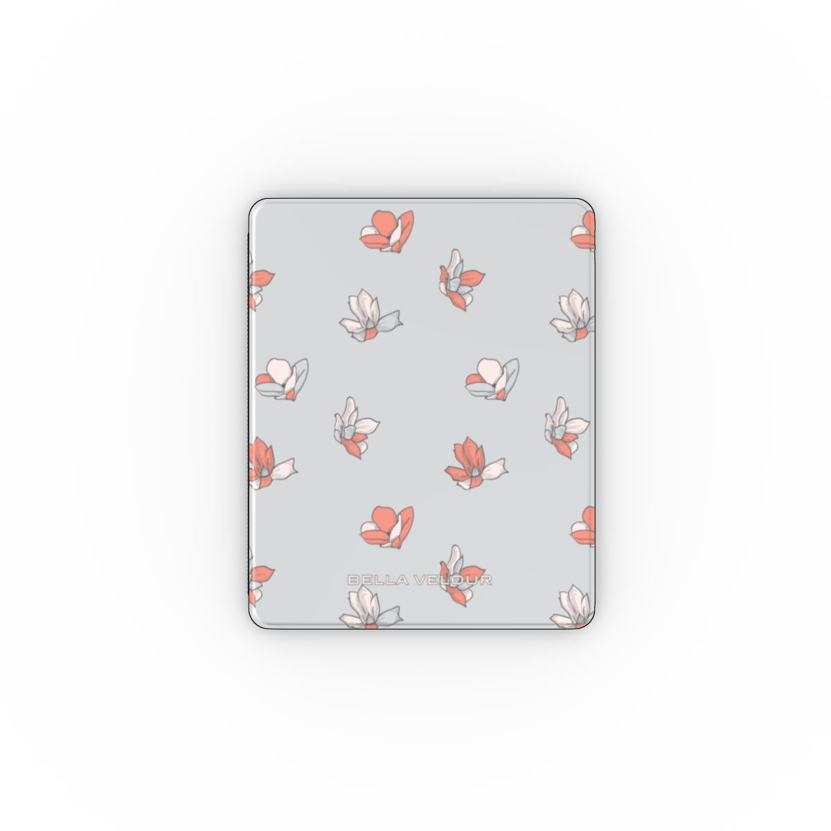 Apple iPad with a light pastel blue and peach floral patterned cover on a light gray background