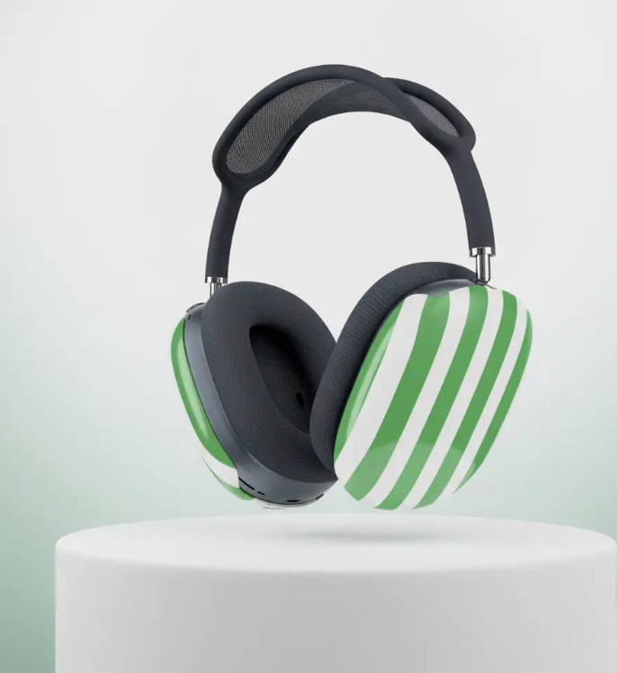 Black airpod max headphones  with  green  and white striped headphones on a white pedestal with a light gray background