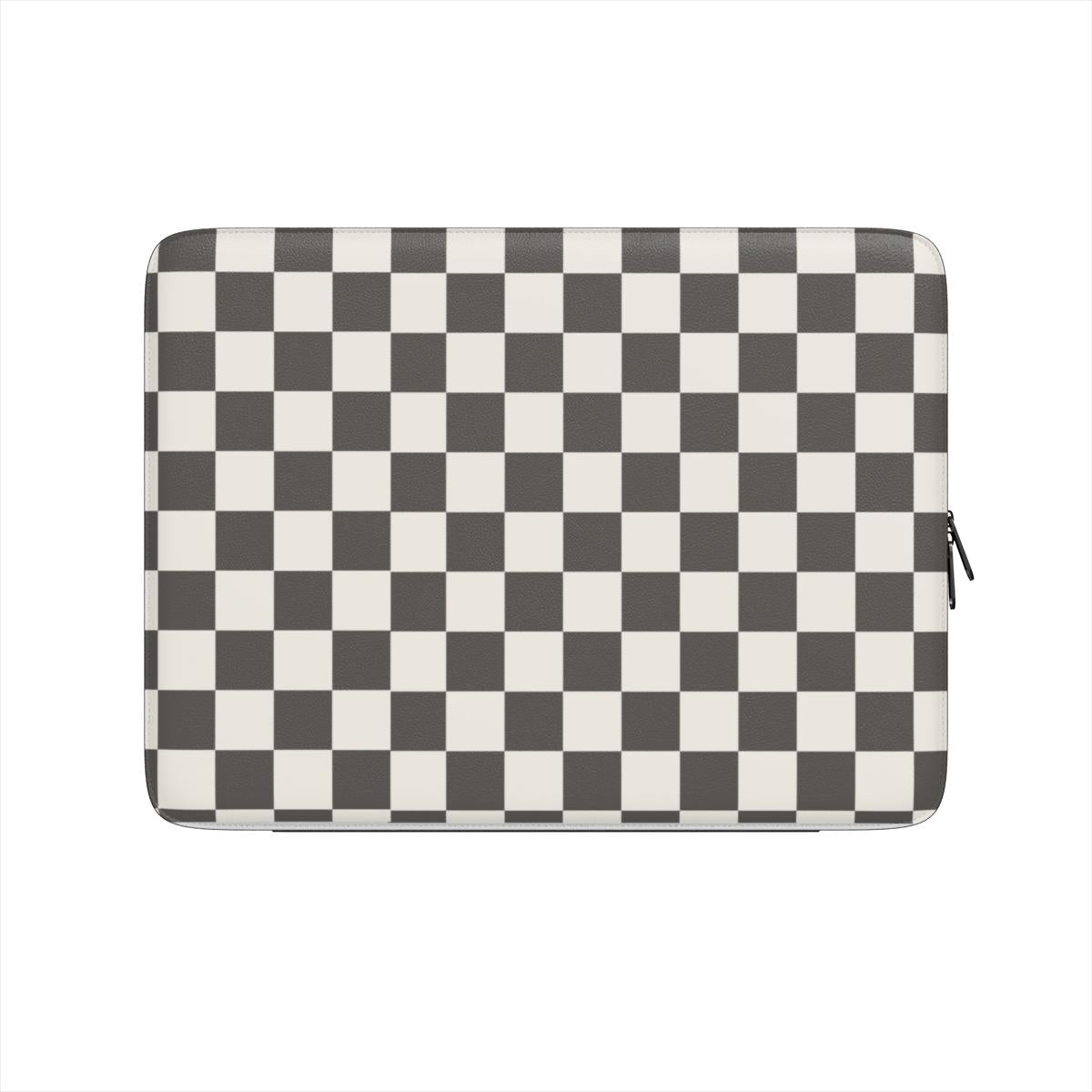 A  black and white checkered design on a luxurious vegan laptop sleeve on a light gray background
