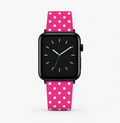 Smartwatch with a pink polka dot strap on a white background